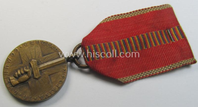 Romanian medal: 'Kreuzzug gegen den Kommunismus' (or in Romanian language: 'Medalia - Crusiada Impotriva Communismului') that comes mounted onto its original (and neatly pre-confectioned!) ribbon as issued