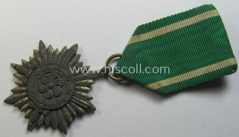 WH-related so-called: 'Tapferkeitsauszeichnung für Angehörige der Ostvölker, 2. Klasse in Silber mit Schwerter' (being a non-maker-marked- and/or: 'Feinzink'-based example that comes mounted onto its period ribbon)