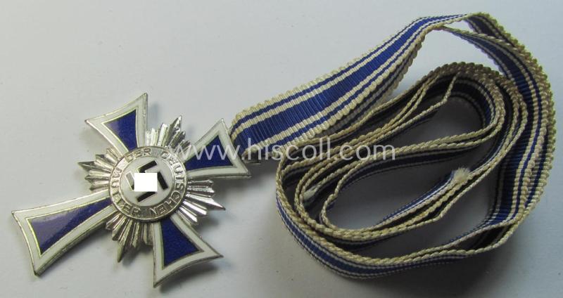 Superb, 'Ehrenkreuz der deutschen Mutter - zweite Stufe' being a non-maker-marked example that comes mounted onto its (large-sized!) ribbon and that comes in an overall very nice- (albeit minimally worn- ie. used-), condition