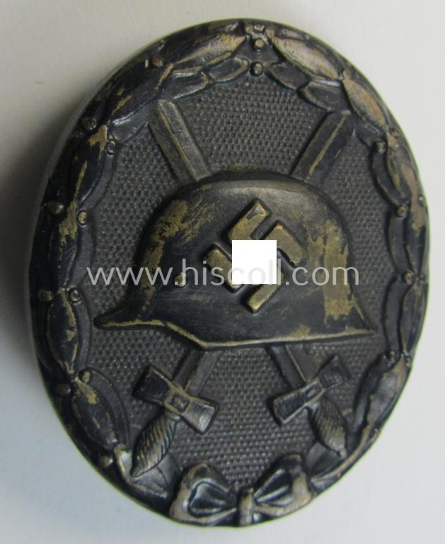 Superb - and just moderately used - neatly maker- (ie. '118'-) marked example of a black-class wound-badge (or: 'Verwundeten-Abzeichen in Schwarz') being an example that was produced by the maker (ie. 'Hersteller') named: 'August Menze & Sohn'