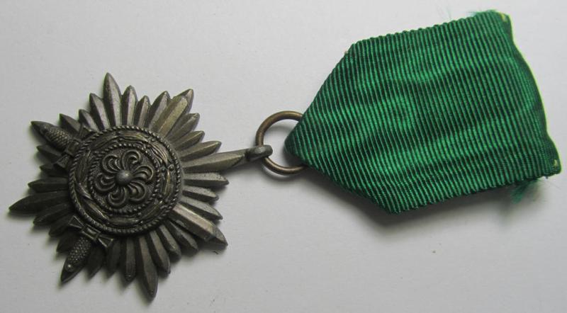 Superb, WH-related so-called: 'Tapferkeitsauszeichnung für Angehörige der Ostvölker, 3. Klasse in Bronze mit Schwertern' (being a non-maker-marked- and/or: 'Feinzink'-based example that comes mounted onto its period ribbon)