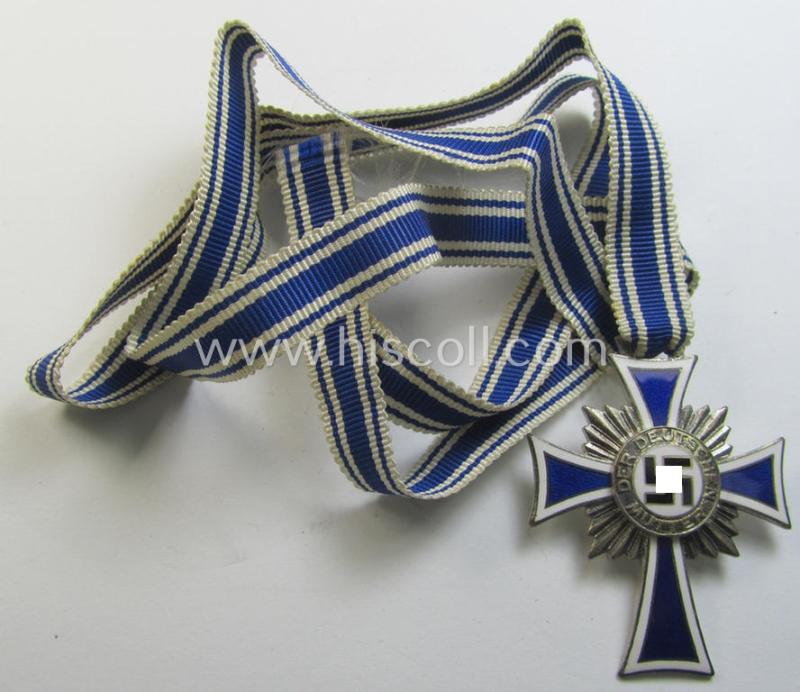 Superb, 'Ehrenkreuz der deutschen Mutter - zweite Stufe' being a non-maker-marked example that comes mounted onto its (large-sized!) ribbon and that comes in an overall very nice- (albeit minimally worn- ie. used-), condition