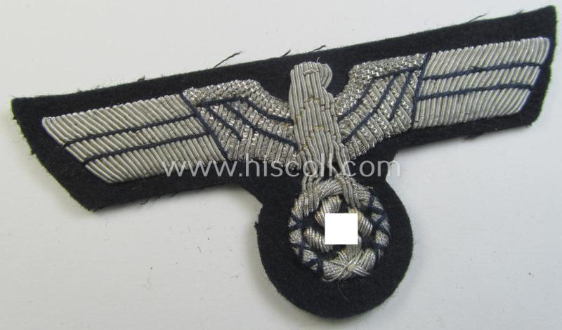 Superb, WH (Kriegsmarine) neatly hand-embroidered, officers'-type breast-eagle on a darker-blue-coloured background as was specifically intended for usage by the various naval administrative-officials (ie. 'Beambten der KM')