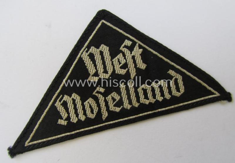 'HJ' ('Hitlerjugend') ie. 'BDM' ('Bund Deutscher Mädel'-) district-triangle (ie. 'Gebietsdreieck') entitled: 'West Moselland' being a moderately used- ie. worn example that misses its paper-based 'RzM'-etiket