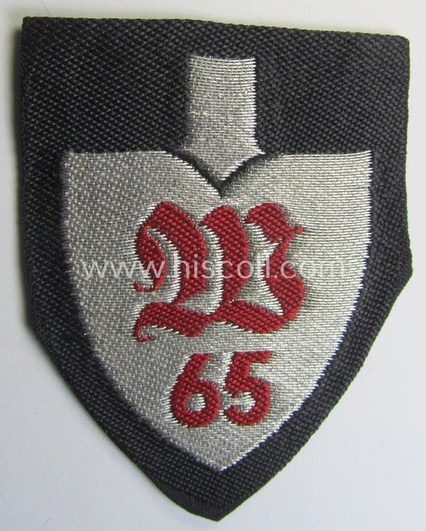 Attractive - and with certainty rarely encountered! - officers'-pattern, so-called: RAD (ie. 'Reichsarbeitsdienst') sleeve-badge (or: 'Dienststellenabzeichen') bearing the (to date unidentified!) specialist-designation: 'W 65'