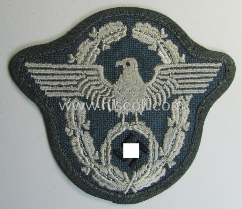 Superb - and scarcely seen! - example of a police- (ie. 'Polizei' ie. 'Verwaltungspolizei'-) related, machine-embroidered-pattern arm-eagle (as was executed in silverish-white-coloured linnen on a typical 'HBT'-like-based background)