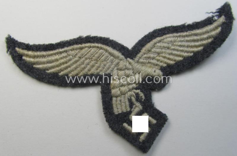 Superb, moderately used- and/or tunic-removed, WH (Luftwaffe) EM- (ie NCO-) pattern, machine-embroidered breast-eagle (showing a 'down-tailed'-eagle and being an early- ie. pre-war-period example) that comes in a moderately used-, condition