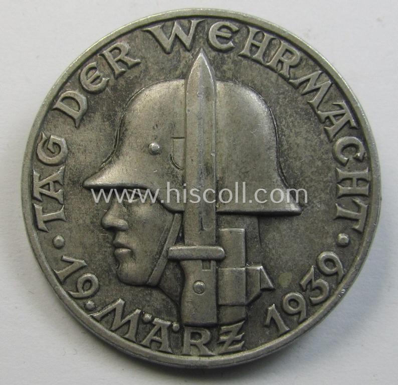 Silver-toned, W.H.W.- (ie. 'Winterhilfswerke'-) related day-badge (ie. 'tinnie') being a non-maker-marked example as was issued to commemorate the: 'WHW'-gathering ie. rally entitled: 'Tag der Wehrmacht - 19 März 1939'