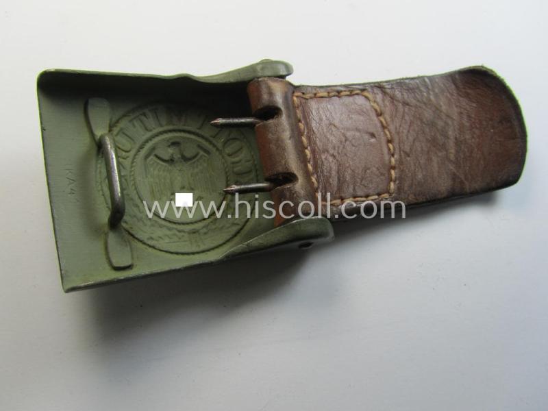 Attractive, WH (Heeres) field-grey-coloured- and/or steel-based belt-buckle being a maker- (ie. 'Jul. Kemp'-) marked- and/or '1941' dated example that comes mounted onto its leather-based tab and that comes in a wonderful condition
