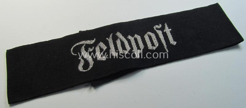 Superb - and most certainly rarely seen! - WH (Heeres) related cuff-title (ie. 'Ärmelstreifen') being a typical black-coloured- and linnen-based example showing the (neatly silver-toned- and 'flatwire'-woven!) text that reads: 'Feldpost'
