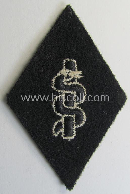 Waffen-SS-pattern, machine-embroidered and/or black- and white-coloured sleeve-insignia (ie. 'Ärmelraute') depicting a so-called: 'HJ-Raute' as was used and intended to signify membership within the 'SS-Sanitätsdienst'