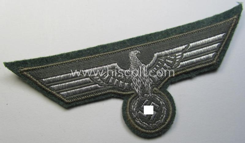 WH (Heeres) breast-eagle as executed in 'BeVo'-type-, so-called: 'flat-wire'-weave-pattern and pre-mounted on field-grey-coloured wool as was specifically intended for usage by soldiers (ie. NCOs) on their dress-tunics (ie. 'Waffenröcke')