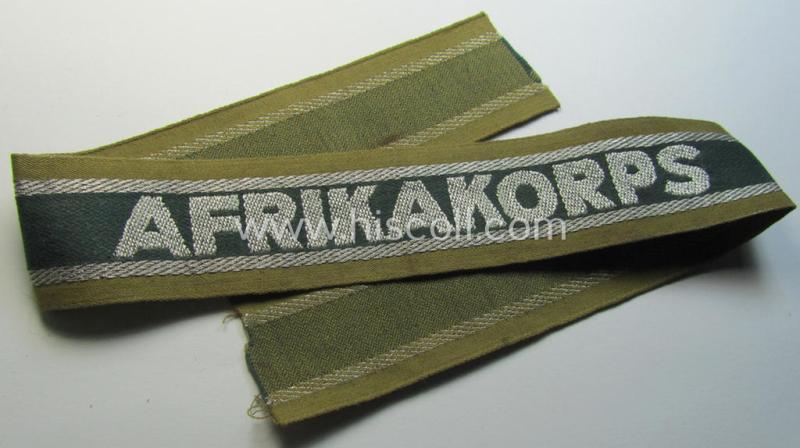 Superb, 'BeVo'-like cuff-title (ie. 'Ärmelstreifen') entitled: 'Afrikakorps' being a presumably issued but never worn example that comes in an overall very nice- (ie. non-shortened- and never tunic-attached-), condition