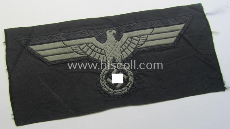 Later- (ie. mid-war-) period, WH (Heeres) 'Panzer'-type breast-eagle (ie. 'Brustadler für Panzertruppen') being a 'virtually mint- ie. unissued' example as executed in bluish-grey-coloured linnen on a black-coloured background