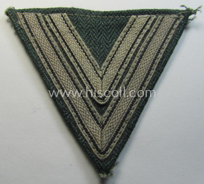 Neat, WH (Heeres ie. Waffen-SS) 'Armwinkel' (or: arm-chevron) as was executed on a greenish-coloured- and/or 'HBT'-like (ie. 'Drillich'-) based background as was specifically intended for usage by an: 'Obergefreiter' (ie. 'SS-Rottenführer')