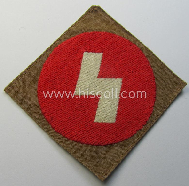 Attractive, DJ (ie. 'Deutsches Jungvolk') arm-badge as was intended for usage by a member who served within the: 'Oberbann 1' (being a 'virtually mint- ie. unissued' example that still shows its period-attached 'RzM'-etiket)