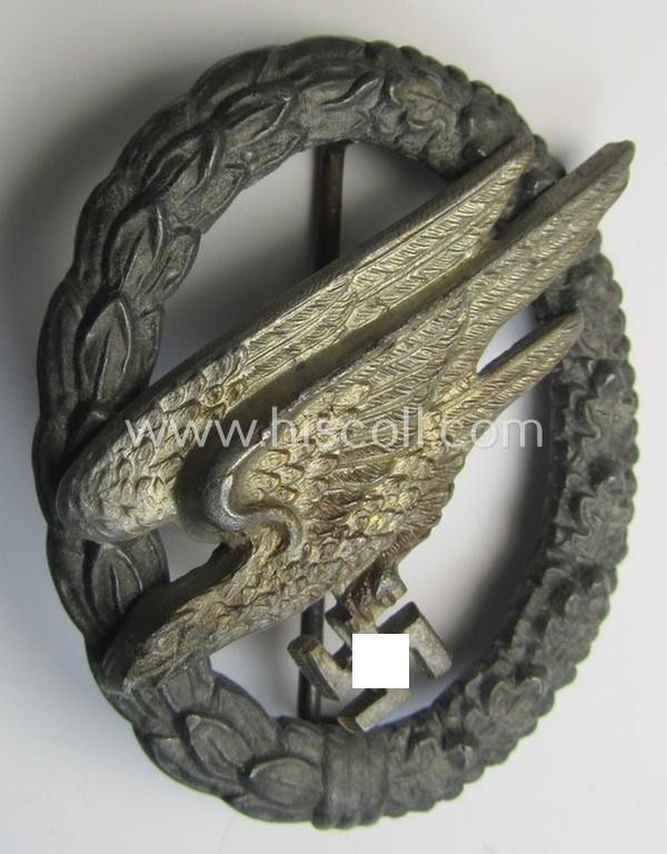Attractive - and I deem mid- (ie. later-) war-period - zinc- (ie. 'Feinzink'-) based version of a WH (Luftwaffe) 'Fallschirmschützen-Abzeichen' (being a non-maker-marked, 'Type H'-pattern example as was produced by the: 'C.E. Juncker'-company)