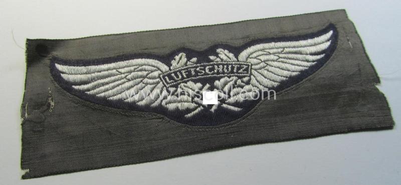 Attractive - and rarely found! - officers'-pattern, so-called: 'Luftschutz' (ie. RLB-) breast-badge (ie. 'Brustabzeichen') as executed in so-called: 'flat-wire', 'BeVo'-weave-pattern and that comes in a 'virtually mint- ie. unissued, condition