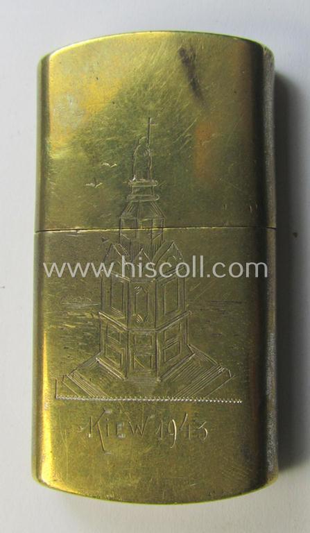 Interesting, mid-war-period WH (Luftwaffe-, Heeres etc.-) related, hand-engraved and copper-based 'souvenir'- (ie. cigarette) lighter depicting a detailed statue and showing the engraved text: 'Kiew 1943'