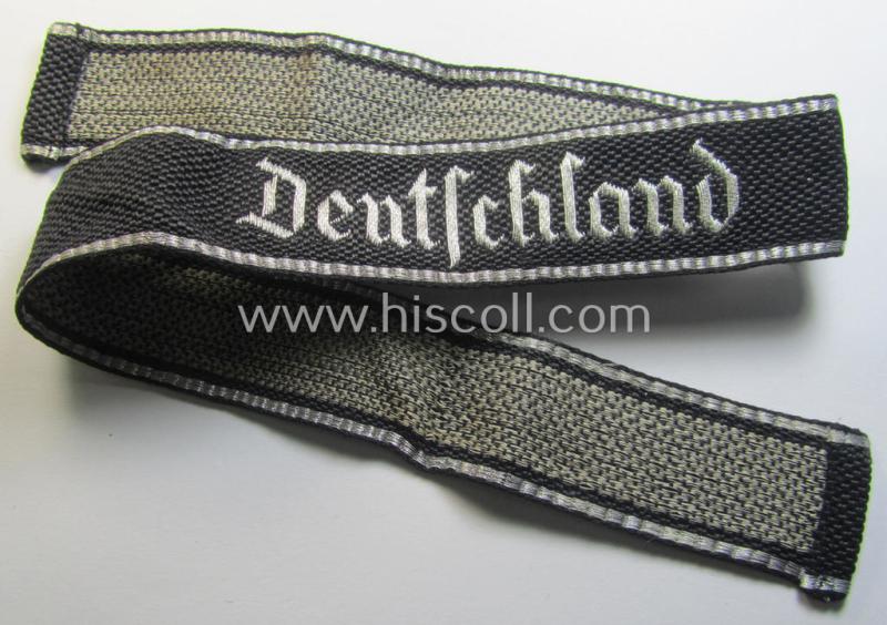 Stunning, Waffen-SS officers-type, 1939/40-pattern cuff-title (ie. 'Ärmelstreifen') as executed in flat-wire 'BeVo'-weave-pattern (in Gothic-styled script!) for an officer who served within the: SS-Rgt. 'Deutschland' (2. SS-Pz-Div. 