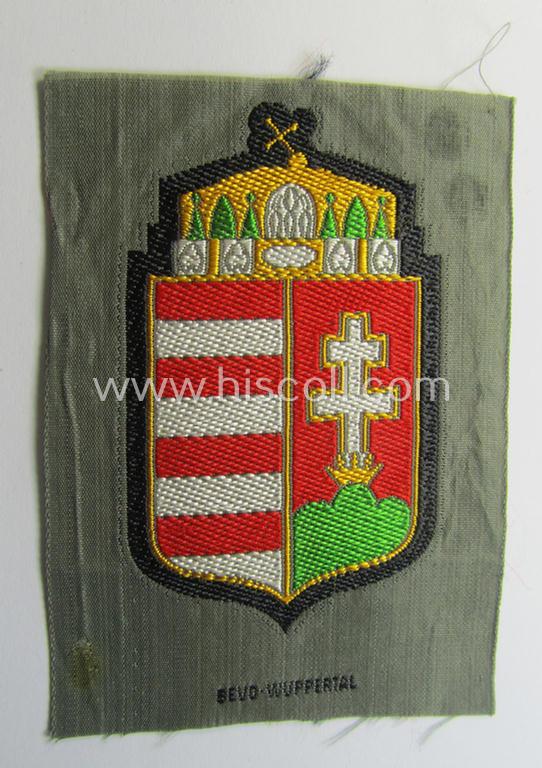 Attractive - and scarcely encountered! - German-produced, 'BeVo'-type armshield showing the coat of arms of Hungary (being a piece that was intended for a volunteer who served within the: 'Deutsche Wehrmacht')