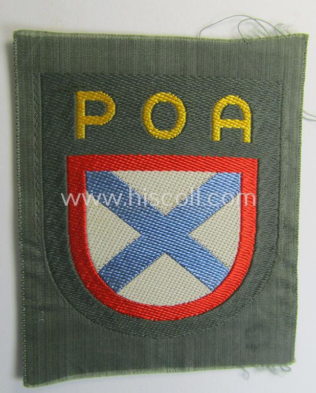 Multi-coloured- and/or 'BeVo'-woven armshield (ie. 'Ärmelschild') as was intended for usage by a Russian volunteer of the 'Russian Liberation Army' (ie. 'POA') that comes in a 'virtually mint- ie. unissued'- and/or never confectioned, condition