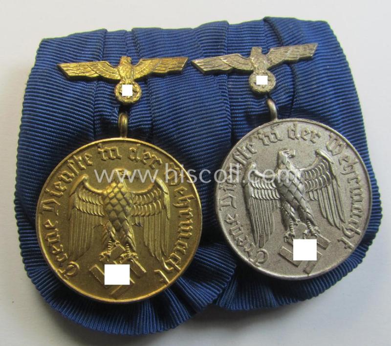 Attractive, two-pieced medal-bar (ie. 'Spange') showing two: WH (Heeres o. Kriegsmarine) so-called: 'Dienstauszeichnungen für 4 u. 12 Jahre Treue Dienste' that both come period-mounted as a so-called: 'Doppelspange'