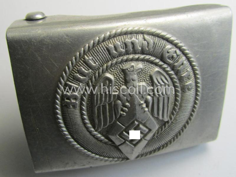 Attractive, HJ (ie. 'Hitlerjugend') silver-coloured- (ie. typically aluminium-based and 'off-factory'-polished) belt-buckle being a neatly maker- (ie. 'RzM M4/38'-) marked example that comes in a just moderately used- ie. worn condition, as found