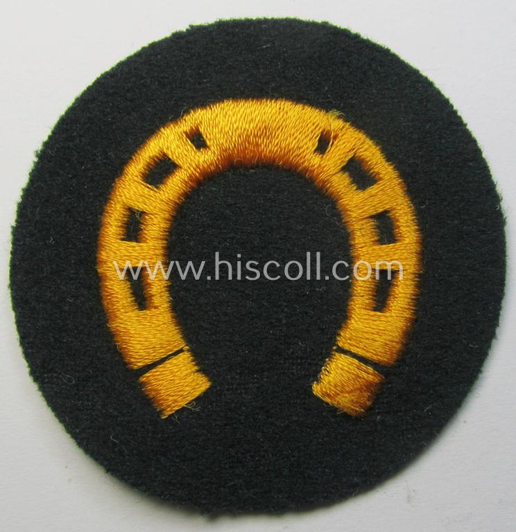 WH (Heeres) so-called trade- and/or special-career arm-patch as specifically intended for a: 'Hufbeschlagmeister' (or: farrier) being a neatly machine-embroidered 'variant' as executed on darker-green-coloured wool