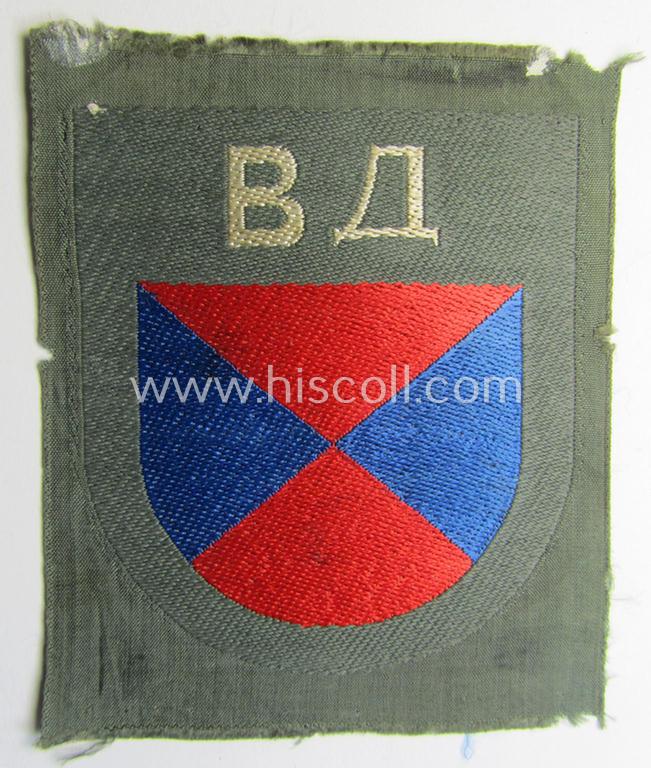 Attractive - and rarely seen! - armshield as executed in the neat 'BeVo'-weave pattern depicting the interwoven 'Cyrillic' characters: 'BA' (as was intended for the Russian volunteers serving within the 'Don Cossacks'
