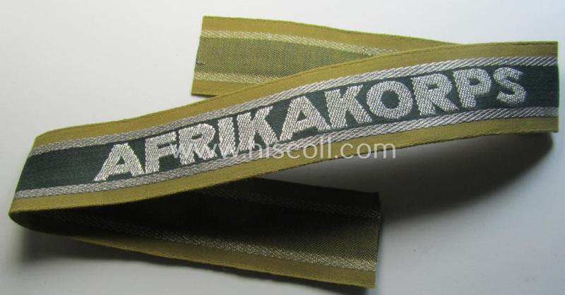 Superb, 'BeVo'-like cuff-title (ie. 'Ärmelstreifen') entitled: 'Afrikakorps' being a presumably issued but simply never worn example that comes in an overall very nice- (ie. non-shortened- and never tunic-attached-), condition