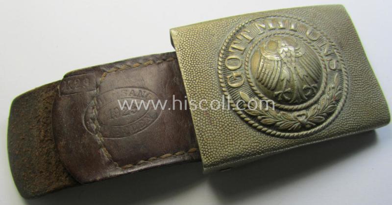 Unusual, 'Reichswehr'-period, silverish-golden-coloured- and/or copper-based belt-buckle that comes mounted onto its (brown-coloured, maker-marked and/or: '1929'-dated) leather-based tab and that comes in a clearly used- ie. worn, condition