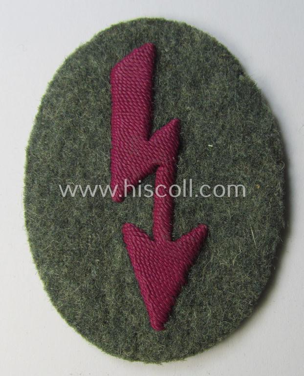 WH (Heeres) trade- and/or special-career-insignia (ie. hand-embroidered 'signal-blitz') being a clearly maker-marked example as executed in bordeaux-coloured linnen as was specifically intended for a soldier within the: '(Nebel)Werfer-Truppen'