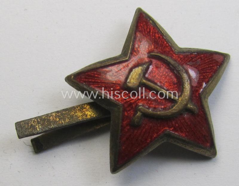 Unusal item that originated from a German soldier: a Russian, smaller-sized and/or WWII-period, enamelled star-shaped cap-badge showing the communist logo on a bright-red-coloured surface (that comes in a cap-removed condition)