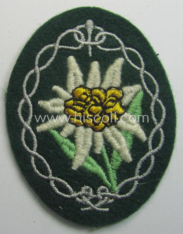 Attractive - and 'virtually mint'! - WH (Heeres) EM- (ie. NCO-) type 'Edelweiss'-armpatch being a machine-embroidered example as was executed on darker-green wool as was intended for usage by the: 'Gebirgsjäger-Truppen' throughout the war