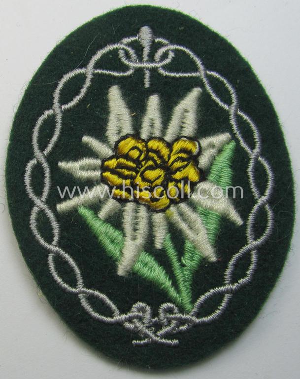 Attractive - and 'virtually mint'! - WH (Heeres) EM- (ie. NCO-) type 'Edelweiss'-armpatch being a machine-embroidered example as was executed on darker-green wool as was intended for usage by the: 'Gebirgsjäger-Truppen' throughout the war