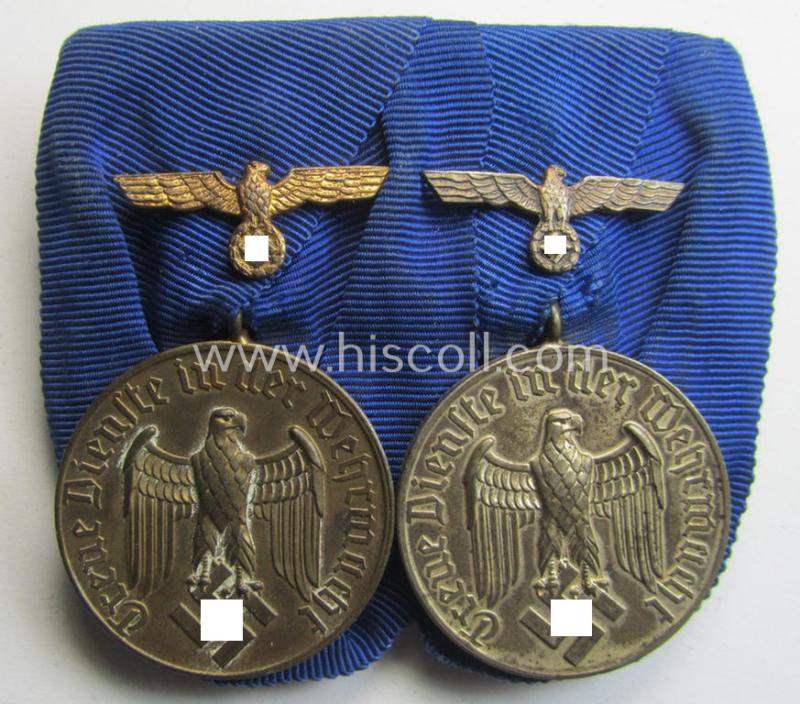 Attractive - and truly used! - two-pieced medal-bar (ie. 'Spange') showing two: WH (Heeres o. Kriegsmarine) so-called: 'Dienstauszeichnungen für 4 u. 12 Jahre Treue Dienste' that both come period-mounted as a so-called: 'Doppelspange'
