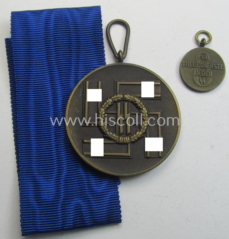 Superb - and actually rarely encountered! - 'SS-Dienstauszeichnung der 3. Stufe' (or loyal-service medal for 8 years of loyal-service in the SS) that comes together with its (never mounted!) ribbon (ie. 'Bandabschnitt') & accompanying 'Halbminiatur'