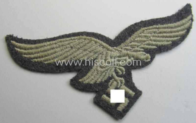 WH (Luftwaffe) 'standard-issue'-pattern breast-eagle (ie. 'Brustadler für Mannschaften u. Uffz. der Luftwaffe') being a machine-embroidered example and that comes in a 'virtually mint' ie. never tunic-attached, condition
