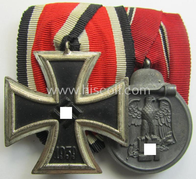 Superb - and truly very nicely preserved! - two-pieced medal-bar (ie. 'Ordenspange') showing resp. an: 'Eisernes Kreuz II. Kl.' and a: 'Medaille Winterschlacht im Osten 1941-42' that come period-mounted as a: 'Doppelspange'
