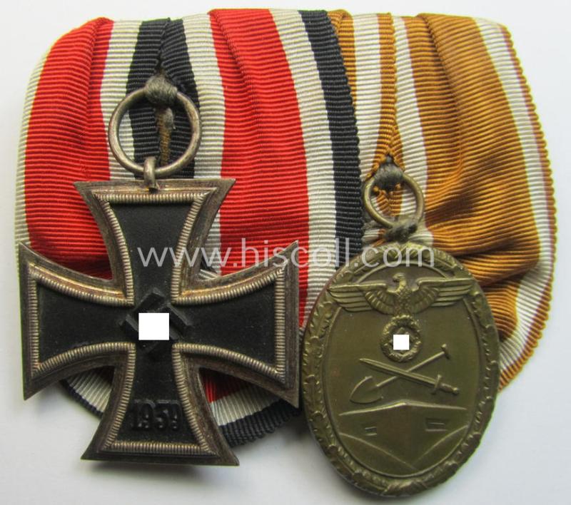 Attractive - and truly very nicely preserved! - two-pieced medal-bar (ie. 'Ordenspange') showing resp. an: 'Eisernes Kreuz II. Kl.' and a: 'Westwall'-medal that come period-mounted as a: 'Doppelspange'