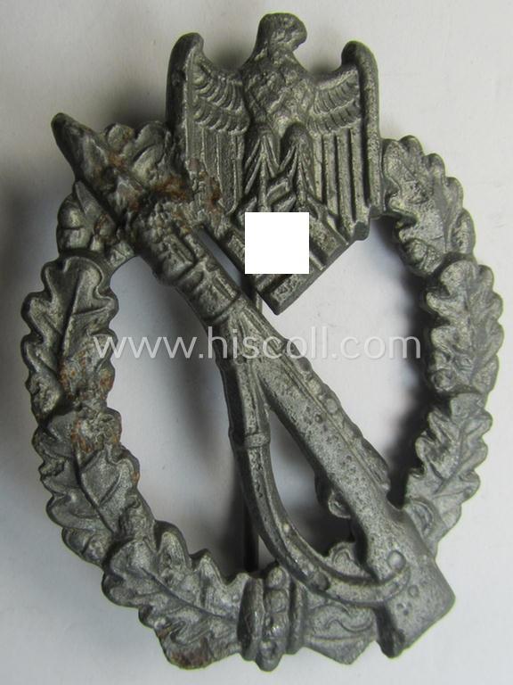 'Infanterie Sturmabzeichen in Silber' (or: silver-class infantry-assault-badge ie. IAB) being a maker- (ie. 'ÜÜ'-) marked, 'solid-back-example as was (I deem) produced by the: 'E. Ferd. Wiedmann'-company and that comes in a relic condition