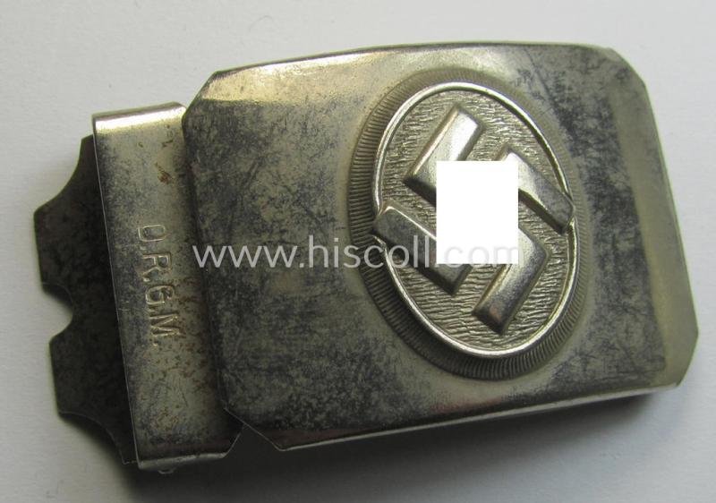 Attractive - and truly unusually seen! - bright-silver-toned (ie. chromed metal-based) patriotic belt-buckle (ie. N.S.D.A.P.-supportive-piece) being a 'virtually mint- ie. unissued' example that shows a swastika surrounded by a silver-coloured rim