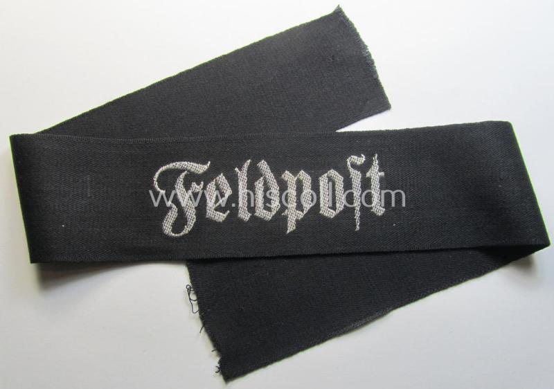 Superb - and most certainly rarely seen! - WH (Heeres) related cuff-title (ie. 'Ärmelstreifen für Führer') being a typical black-coloured- and linnen-based example showing the (neatly silver-toned- and 'flatwire'-woven!) text that reads: 'Feldpost'
