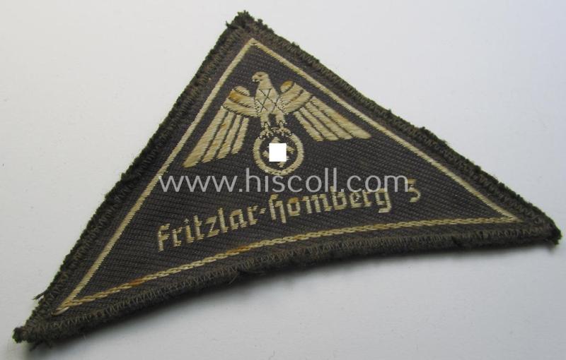 Attractive, German Red Cross (ie. 'Deutsches Rotes Kreuz' or 'DRK') related, EM- (ie. NCO-) type, greyish-coloured- and/or (typically) triangular-shaped arm-eagle as executed in the neat 'BeVo'-weave pattern entitled: 'Fritzlar-Homberg 3'
