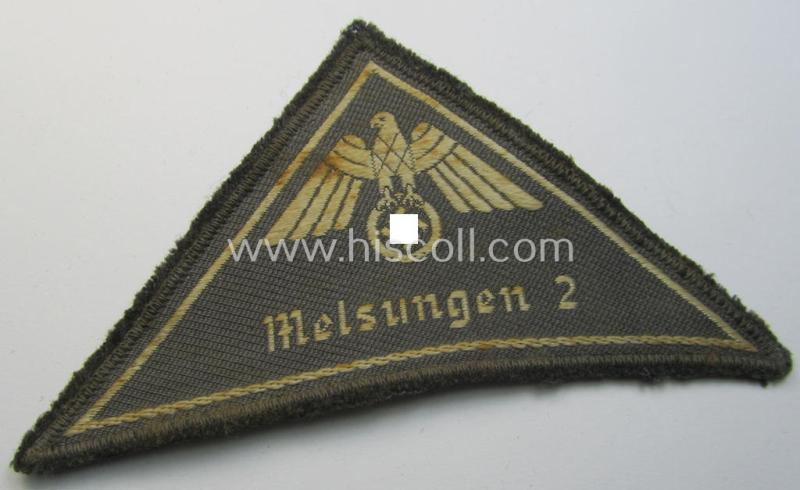 Attractive, German Red Cross (ie. 'Deutsches Rotes Kreuz' or 'DRK') related, EM- (ie. NCO-) type, greyish-coloured- and/or (typically) triangular-shaped arm-eagle as executed in the neat 'BeVo'-weave pattern entitled: 'Melsungen 2'