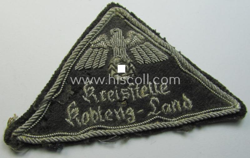 Superb, German Red Cross (ie. 'Deutsches Rotes Kreuz' or 'DRK') related officers'-type, greyish-coloured- and/or (typically) triangular-shaped arm-eagle as executed in detailed hand-embroidery entitled: 'Kreisstelle Koblenz-Land'