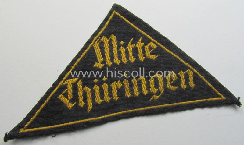 Attractive - and scarcely encountered! - 'HJ' ('Hitlerjugend') district-triangle (ie. 'Gebietsdreieck') entitled: 'Mitte Thüringen' being a moderately used- ie. worn example that retains its period-attached 'RzM'-etiket