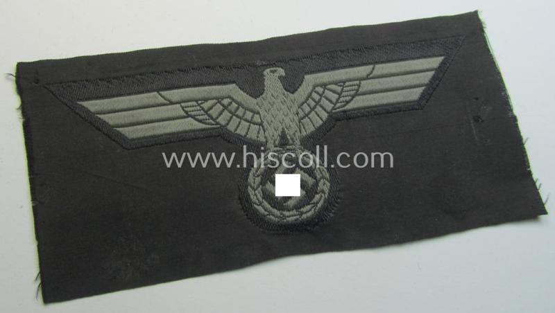 Later- (ie. mid-war-) period, WH (Heeres) 'Panzer'-type breast-eagle (ie. 'Brustadler für Panzertruppen') being a 'virtually mint- ie. unissued' example as executed in bluish-grey-coloured linnen on a black-coloured background