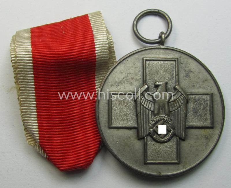 Attractive, silver-toned (and I deem zinc- ie. 'Feinzink'-based!) 'Deutsche Volkspflege'- (ie. civil-service) medal being a non-maker-marked example that came together with its (confectioned- and somewhat shortened) ribbon (ie. 'Bandabschnitt')